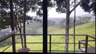 a view from a balcony with a view of a field at La Casita El Perezoso in San Rafael