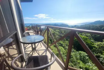 a balcony with a table and chairs and a view at Casa Pura Vista in Playa Hermosa