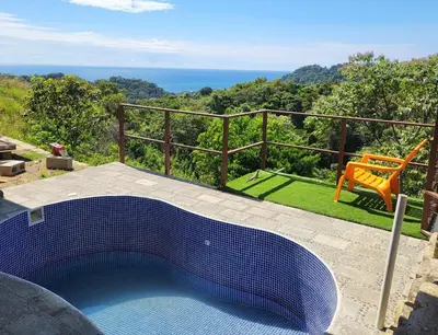 a blue bath tub sitting on top of a patio at Casa Pura Vista in Playa Hermosa