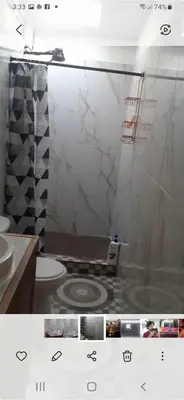 a bathroom with a shower and a toilet and a sink at Casa iguana in Potrero