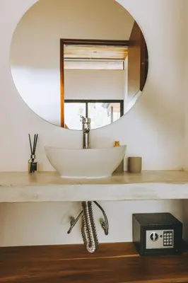 a bathroom with a sink and a mirror at CASA ROBLE, One-Bedroom with Pool in Paradise, Quiet and Fast WiFi in Santiago