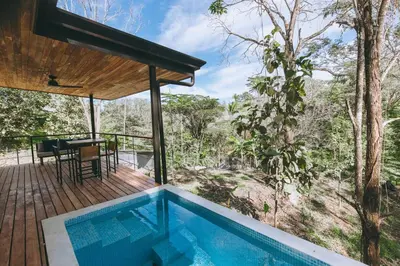 a house in the middle of a forest with a swimming pool at CASA ROBLE, One-Bedroom with Pool in Paradise, Quiet and Fast WiFi in Santiago