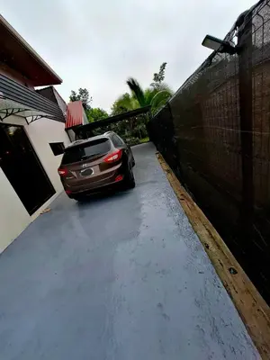 a car parked in the driveway of a house at My Costa Rica Home Place in Tetsalia