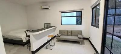 a hospital room with a bed and a chair at Dynamis Retreat in Tamarindo