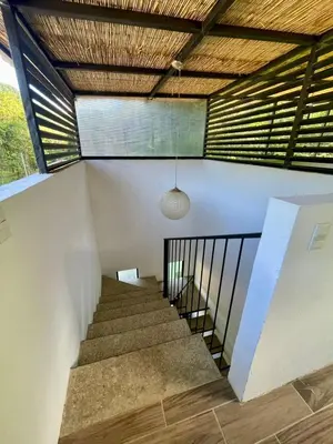 a staircase in a house with a ceiling at Tesoro Escondido in Naranjito