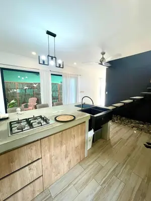 a kitchen with a sink and a counter top at Tesoro Escondido in Naranjito