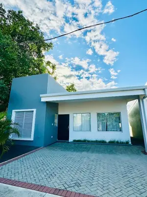 a blue and white house with a driveway at Remote Work Haven 15 Minutes from the Beach in Sardinal
