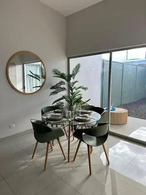 a dining room with a table and chairs and a mirror at Remote Work Haven 15 Minutes from the Beach in Sardinal