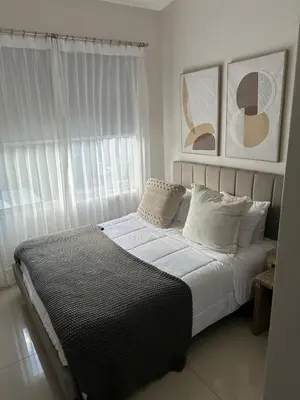 a bedroom with a bed with white sheets and pillows at Remote Work Haven 15 Minutes from the Beach in Sardinal