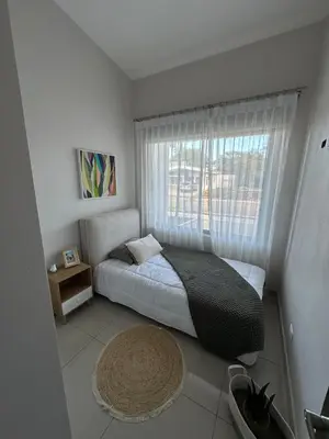 a small bedroom with a bed and a window at Remote Work Haven 15 Minutes from the Beach in Sardinal