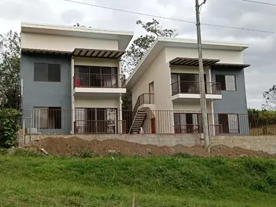 a house with balconies on the side of it at Vista Serena la Guácima in Alajuela City