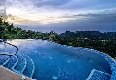 a swimming pool with a view of the mountains at Mar a Mar 09-04C in Punta Leona