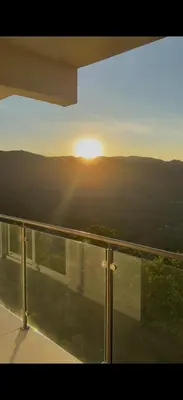 a view of the sun setting from a balcony at Mar a Mar 09-04C in Punta Leona