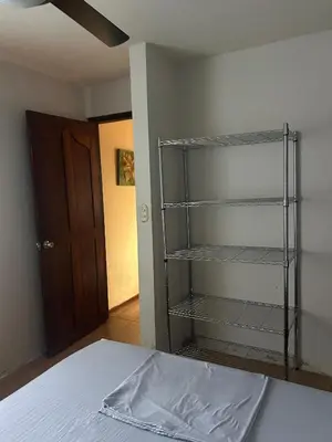 a empty room with a bed and a closet at Private Room One block from the beach in Coco