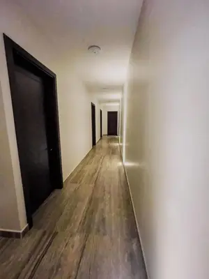 an empty hallway with wooden floors and a door at Casa Pura Vida in Coco
