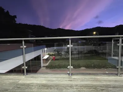 a view of a building with glass windows at night at Casa Pura Vida in Coco