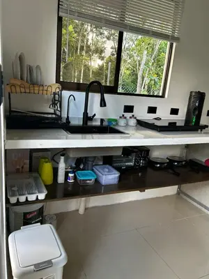 a kitchen counter with a sink and a window at Bungalows Chachagüita in Chachagua