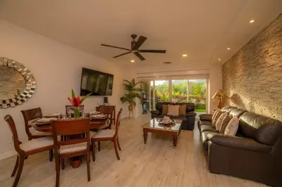a living room with a couch and a table at Del Mar 4M - 3 bdr 2 bath Condo in Herradura