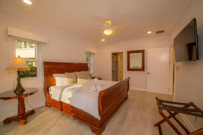a bedroom with a large bed and a ceiling fan at Del Mar 4M - 3 bdr 2 bath Condo in Herradura