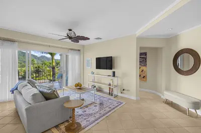 a living room with a couch and a tv at Del Mar 5F 3 bedr 2 bath in Herradura