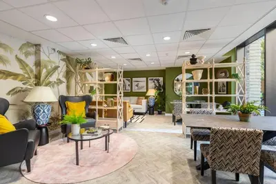 a living room with chairs and a table at Cocogarden in Coco