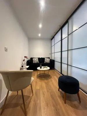 a living room with a couch and a table at Cocogarden in Coco