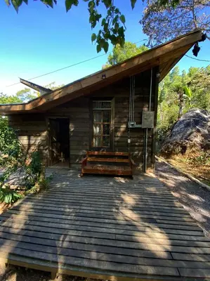 a small wooden building with a wooden porch at Pipe's Cabin in San Pablo