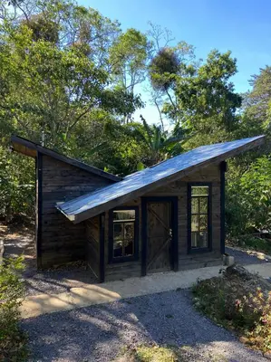 a small log cabin with a pitched roof at Pipe's Cabin in San Pablo