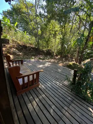 a wooden deck with a bench on top of it at Pipe's Cabin in San Pablo