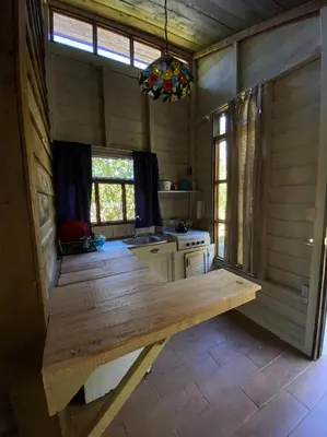 a kitchen with a wooden counter in a room at Pipe's Cabin in San Pablo