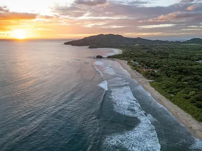 an aerial view of a beach at sunset at Pinilla Living Studio 2 in Santa Cruz