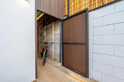 a bike is parked in a garage at Pinilla Living Studio 2 in Santa Cruz