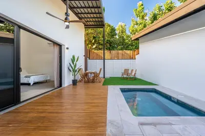a swimming pool in the backyard of a house at Pinilla Living Studio 2 in Santa Cruz