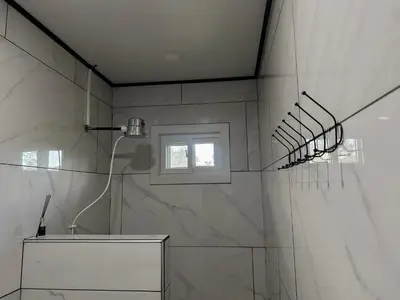 a bathroom with a shower with a window at Cozy Studio with private tropical forest in Tanque