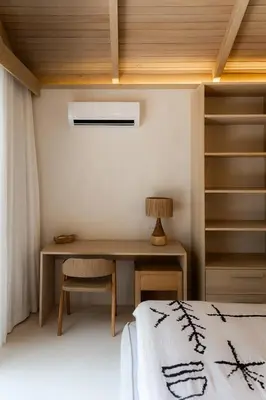 a bedroom with a desk and a bed at GoldCoast Villa Santa Teresa in Santa Teresa Beach