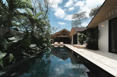 a swimming pool in front of a house at GoldCoast Villa Santa Teresa in Santa Teresa Beach