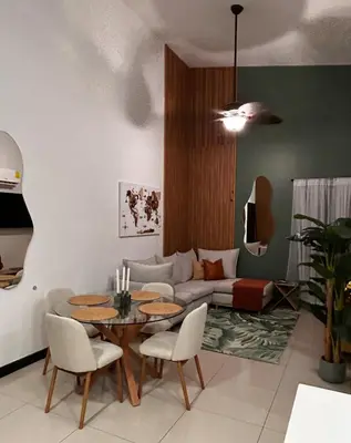 a living room with a table and a couch at Secure Retreat Near SJO and 27, Ideal for Families in Nuestro Amo
