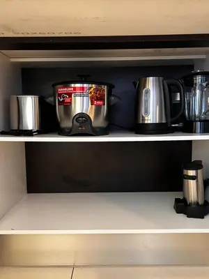 a coffee maker on a shelf in a kitchen at Secure Retreat Near SJO and 27, Ideal for Families in Nuestro Amo