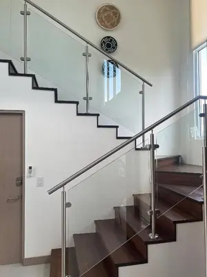 a staircase with glass railings in a house at New 4BDR Ocean Mountain View Villa - Mar a Mar in Punta Leona