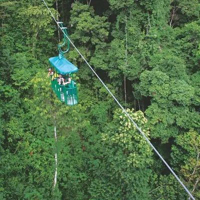 a group of people riding a zip line in the forest at New 4BDR Ocean Mountain View Villa - Mar a Mar in Punta Leona