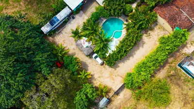 an overhead view of a swimming pool in a yard at Selva Partners Tamarindo in Matapalo
