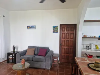 a living room with a couch and a table at El Diamante - Playa Hermosa in Playa Hermosa