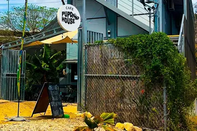 a building with a sign that reads one private houses at Pupa House Hotel in Tamarindo