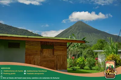 a rendering of a house with a mountain in the background at Tío Felix Eco Lodge in Fortuna