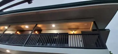 a balcony of a house with lights on it at Apartamentos Jireh in Quepos