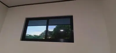 a window in a white room with a view at Apartamentos Jireh in Quepos