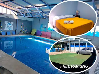 a bedroom and a pool with a bed and a car at Airport Nest Costa Rica Hotel in Alajuela City