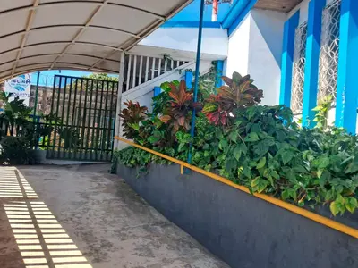 a balcony with plants on the side of a building at Airport Nest Costa Rica Hotel in Alajuela City