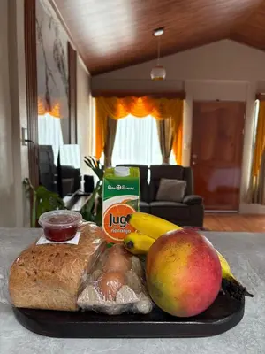 a tray of food with fruit and nuts on a table at Dreams of Golden Wings in Monteverde Costa Rica