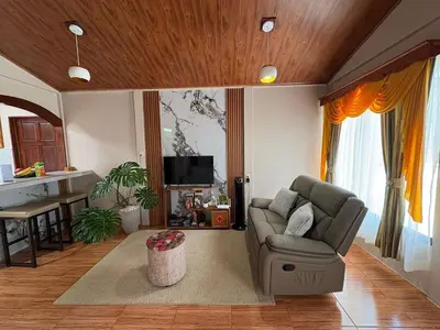 a living room with a couch and a table at Dreams of Golden Wings in Monteverde Costa Rica